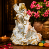Elegant White and Gold Krishna with Flute Statue Sitting on Tree Trunk for Home Temple and Living